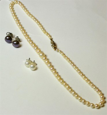 Lot 149 - A cultured pearl necklace, with split pearl set clasp and two pairs of cultured pearl stud earrings