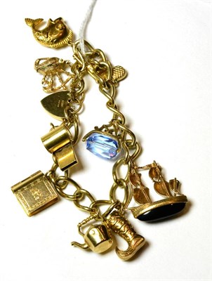 Lot 154 - A 9ct gold curb link charm bracelet, with attached 9ct gold charms