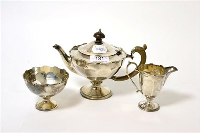 Lot 181 - A three piece silver bachelor's tea set, Birmingham, 1920 by E.S.B. of pedestal form with...