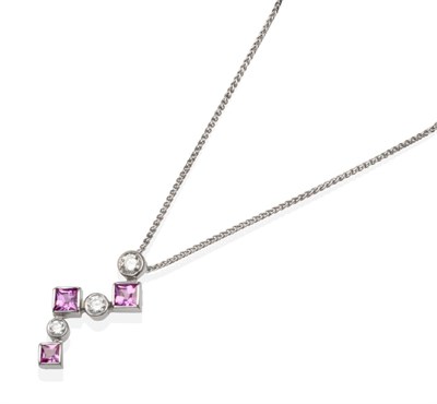 Lot 316 - An 18 Carat White Gold Pink Sapphire and Diamond Pendant on Chain, of graduated alternating...