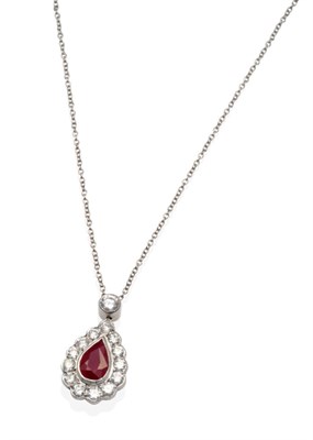Lot 317 - A Ruby and Diamond Pendant, on Chain, a round brilliant cut diamond in a milgrain setting...