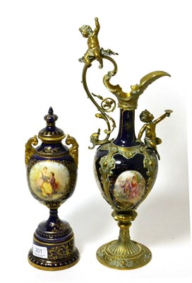 Lot 201 - A 19th century Vienna porcelain urn and cover painted with a vignette of a courting couple together