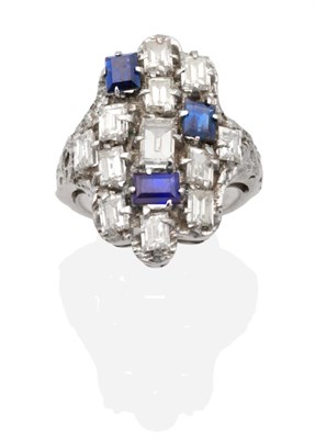 Lot 321 - A 1970s Diamond and Sapphire Cluster Ring, an amorphous plaque set with three baugette cut...