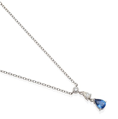 Lot 322 - An 18 Carat White Gold Sapphire and Diamond Pendant Necklace, a round brilliant cut diamond in...