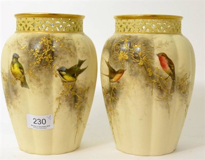 Lot 230 - A pair of Royal Worcester blush ivory G & Co vases decorated with birds