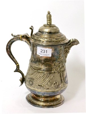 Lot 231 - An 18th century style silver plated covered tankard, later decorated with heavy repousse...