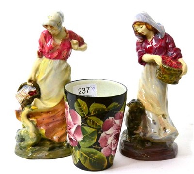 Lot 237 - A Wemyss beaker and two Royal Doulton figures: Fruit Gathering HN707 and The Goose Girl HN559