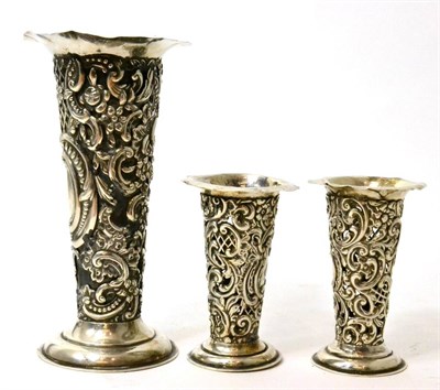 Lot 238 - Silver vase and similar pair