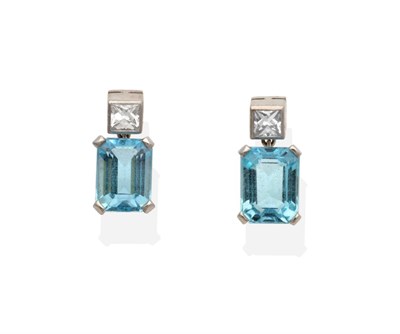 Lot 325 - A Pair of 18 Carat White Gold Aquamarine and Diamond Earrings, a princess cut diamond in a...