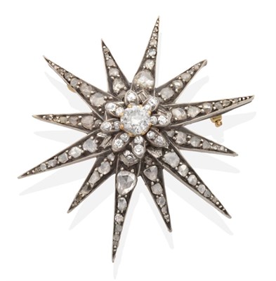 Lot 327 - A Victorian Diamond Star Brooch, a central old cut diamond in a collet setting within a border...
