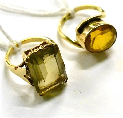 Lot 284 - A 9ct gold ring with coloured stone and a yellow metal ring with large rectangular stone