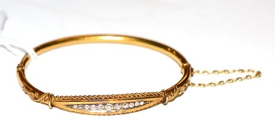 Lot 289 - A Victorian diamond set stiff hinge bangle