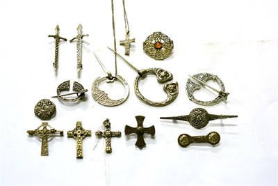 Lot 308 - A collection of Scottish style silver and white metal plaid brooches, dirk brooches and Celtic...