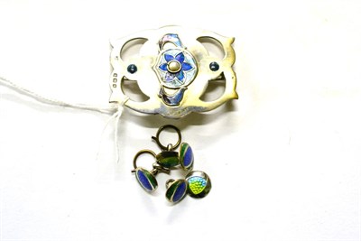 Lot 309 - An Art Nouveau silver, enamel and seed pearl brooch by James Fenton, adapted from a buckle,...