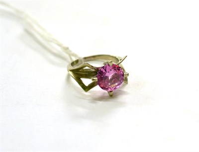 Lot 311 - A synthetic pink sapphire ring, stamped '10k', finger size N