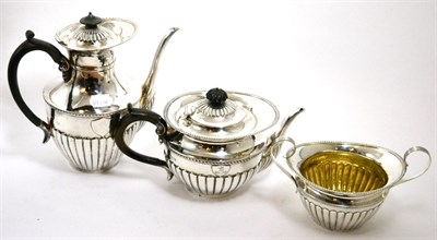 Lot 328 - Mappin & Webb silver three piece tea set with part gadrooned body