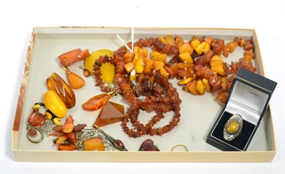 Lot 361 - Three amber bead necklaces and various amber type pendants, brooches and rings