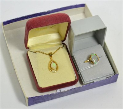 Lot 362 - An opal and diamond pendant necklace and an opal ring, stamped 585