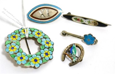 Lot 374 - A silver and enamel brooch by A.H. Darby & Son and four other enamel brooches (5)