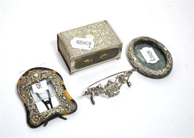 Lot 380 - Two small silver photo frames, a matchbox holder, menu holder and two cased napkin rings