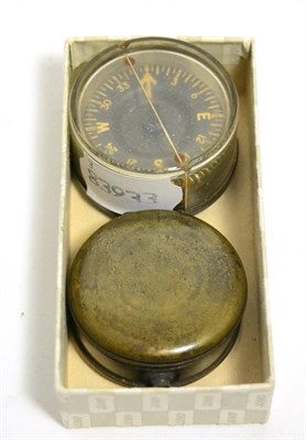 Lot 384 - A Victorian pocket compass by Watson & Son, High Holborn, London and a US Aircrew combat...