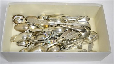 Lot 387 - A quantity of assorted silver spoons, sugar tongs etc