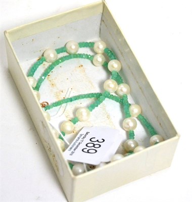 Lot 389 - A cultured pearl and emerald bead necklace, round cultured pearls spaced by groups of faceted...