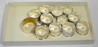 Lot 408 - Eleven silver and one plated napkin ring (12)