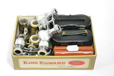 Lot 410 - Nine pairs of opera glasses, including one silver mounted example,  four in cases