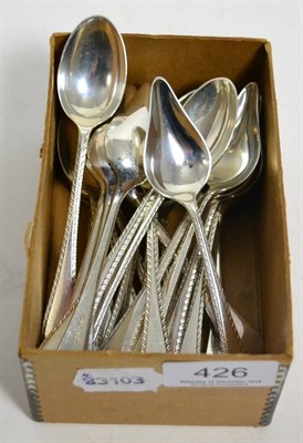 Lot 426 - A set of twelve silver teaspoons and grapefruit spoons, with feather edges, James Dixon & Sons,...