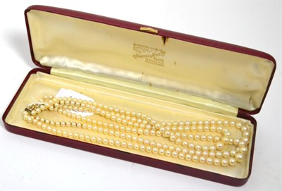 Lot 429 - A three row cultured pearl necklace on 9ct gold seed pearl set clasp