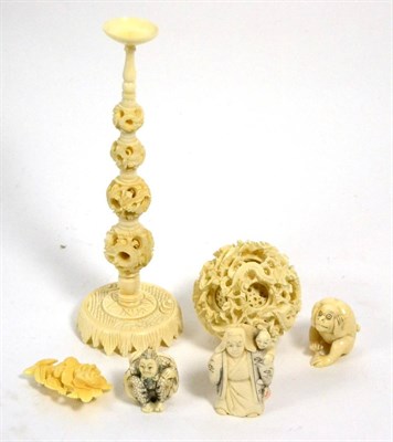 Lot 459 - An ivory group including three netsuke, puzzle ball and stand (a.f.)  and a brooch