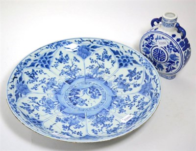 Lot 460 - A Chinese blue and white moonflask together with a blue and white floral charger (2)