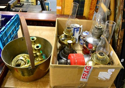 Lot 1011 - Assorted oil lamps, a brass jam pan, brass candlesticks, other items including brassware and...