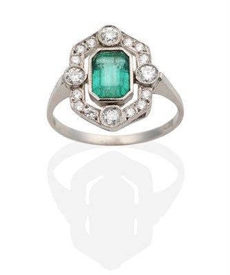 Lot 351 - An Art Deco Emerald and Diamond Ring, an octagonal cut emerald in a milgrain setting within a...