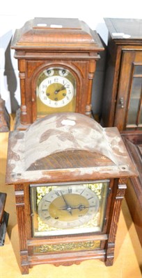 Lot 1045 - An oak cased table clock together with another (2)