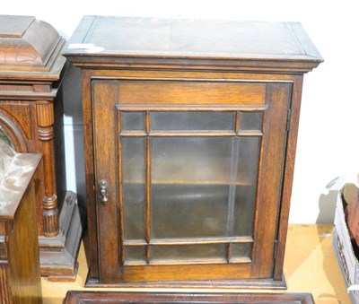 Lot 1046 - An oak collectors' cabinet