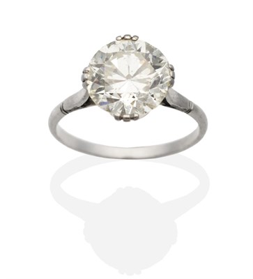 Lot 355 - A Solitaire Diamond Ring, an old cut diamond in a triple claw setting, to tapering notched...