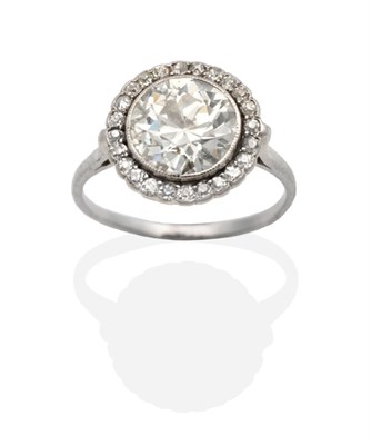 Lot 357 - An Art Deco Diamond Cluster Ring, an old cut diamond in a milgrain setting within a border of...