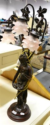 Lot 1107 - A bronzed figural lamp with three glass shades