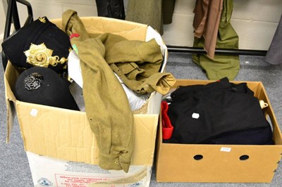 Lot 1114 - A quantity of post-Second World War uniforms, police uniforms, helmets, belts, ties etc (in two...