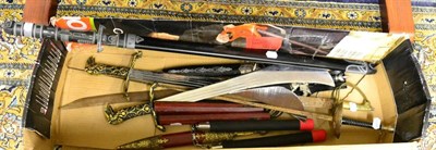 Lot 1115 - A box containing various modern martial arts equipment and swords etc