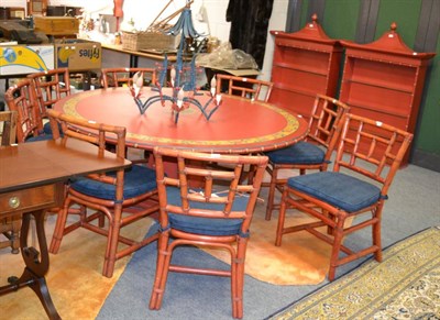 Lot 1140 - A Chinese style coral and floral painted dining room suite, comprising a circular dining table with