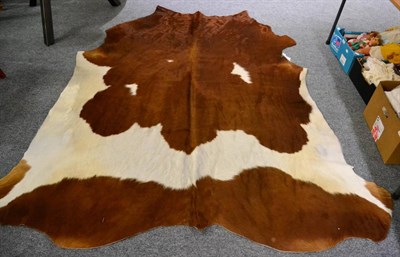 Lot 1151 - Nguni Cow Hide (Bos taurus), modern excellent quality AA grade brown and white cow hide floor...