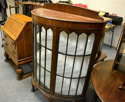 Lot 1167 - Oak bureau and a mahogany china cabinet (2)