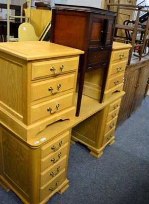 Lot 1173 - A modern oak twin pedestal dressing table, a pair of matching bedside chests and a canework...