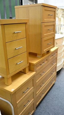 Lot 1185 - A contemporary birch four height chest of drawers, a pair of matching bedside chests, matching...