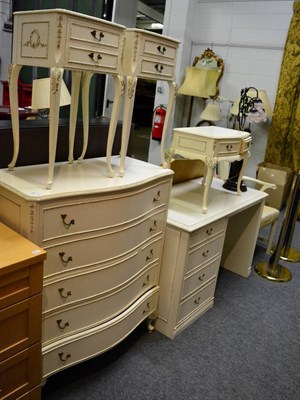 Lot 1186 - Cream painted bedroom suite, comprising: knee hole dressing table, chest of drawers, pair of...