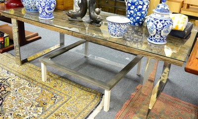 Lot 1191 - A reproduction plank top dining table with glass top