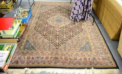 Lot 1199 - A Feraghan design carpet, probably India, the stepped indigo Herati field with a hexagonal...